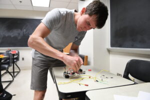 Brian Tavenner ’25, an electrical and computer engineering major at Virginia Military Institute, designing and building a fiberglass rocket to reach the exact height of 1,023 feet using a F-engine motor in his five-week Summer Undergraduate Research Institute (SURI) project.