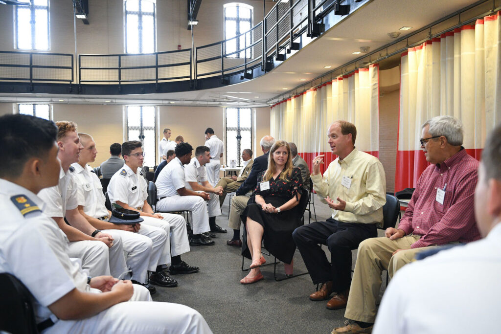 Alumnni speak with cadets.