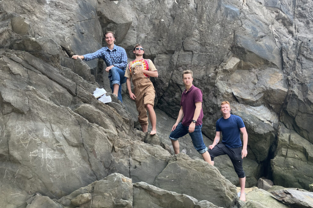 Cadets climb up a path in the cliffs.