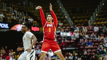 cadet follows through on a basketball shot.