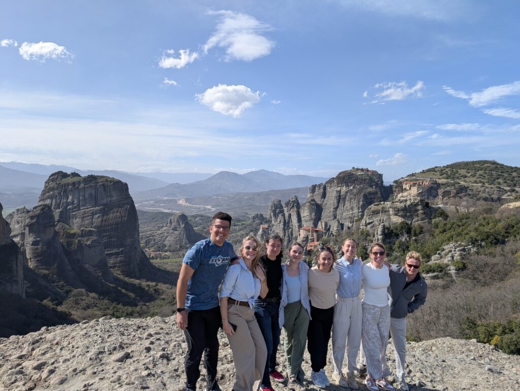 Cadets pose with rock formations and clear blue skies in the background.
