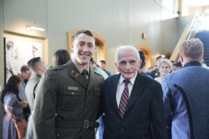 VMI cadet embraces a guest of honor.