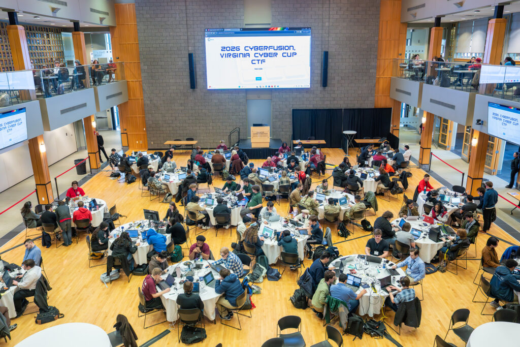 conference attendees gather at tables in the Hall of Valor at VMI.
