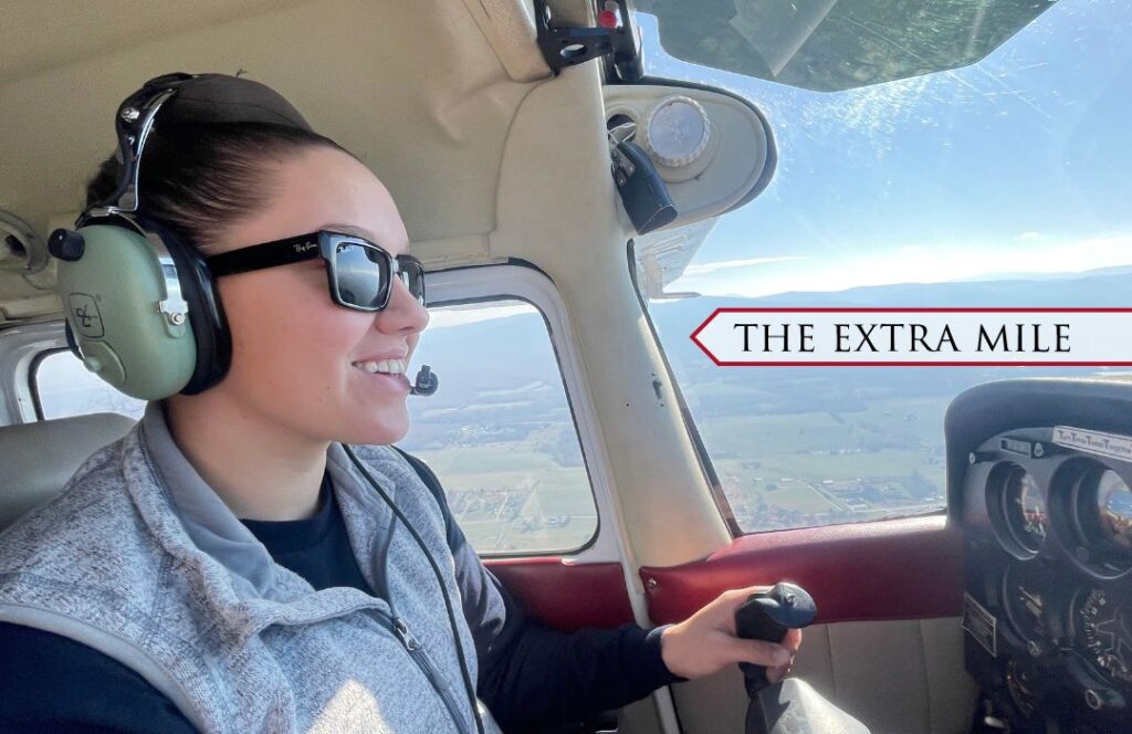Carter Wasser ’25 takes the wheel behind a plane and flies it in the sky.