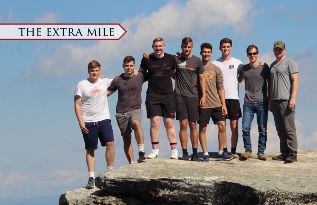 The Rock Climbing Club at VMI atop a mountain cliff.