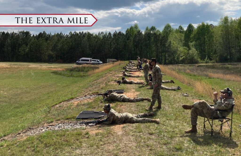 Cadets at an outdoor shooting range for practice.
