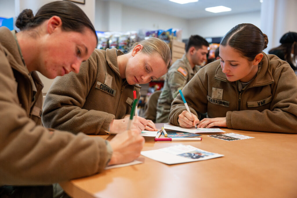 New cadets personalize holiday greet cards for senior community residents.