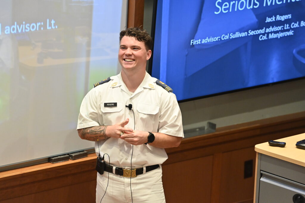 Cadet Jack Rogers smiles during his honors thesis presentation.