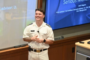 Cadet Jack Rogers smiles during his honors thesis presentation.