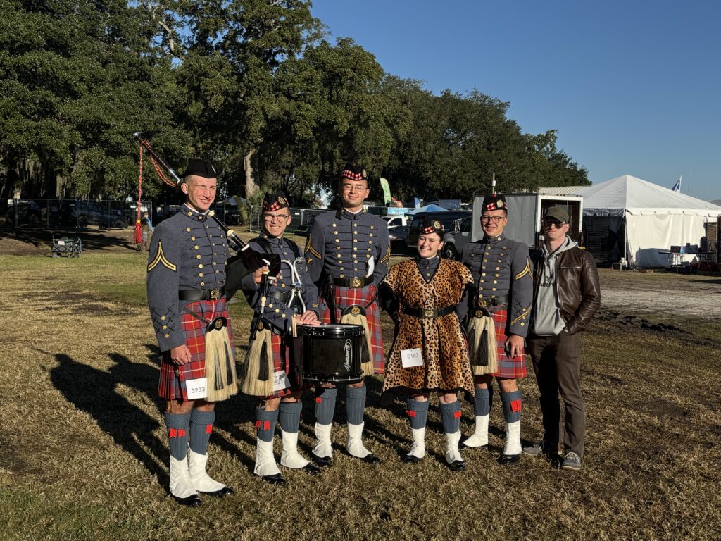 VMI Pipe Band members post for a group photo.