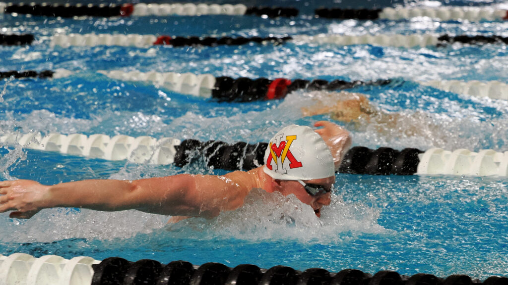 A swimmer swims in the pool.
