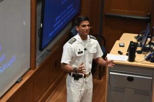 Cadet speaks to the audience during senior thesis presentations at VMI.