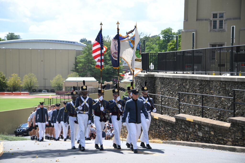 Blake Smith ’23 leads the Corps of Cadets up to barracks.