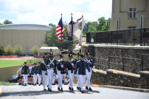 Blake Smith ’23 leads the Corps of Cadets up to barracks.