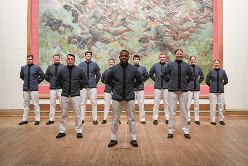 Cadets pose on the stage as part of the 184th Regiment of the Institute.