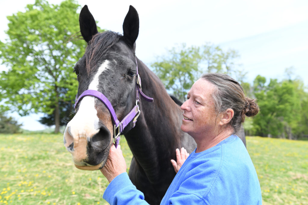Belva Drain and her American paint horse "Peepers."