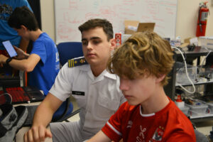 Joseph Gilman ’23 works with James Hanstedt on the ‘virtual city’ during the CCI high school internship program.