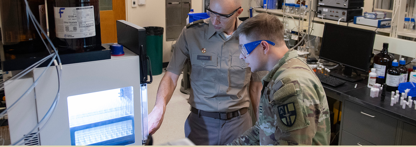 A chemistry professor and student study materials in a lab at VMI.