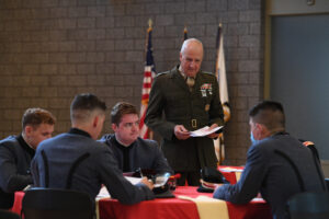 Professors discuss with cadets.