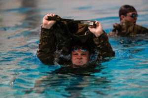 A cadet in OCPs in the swimming pool.