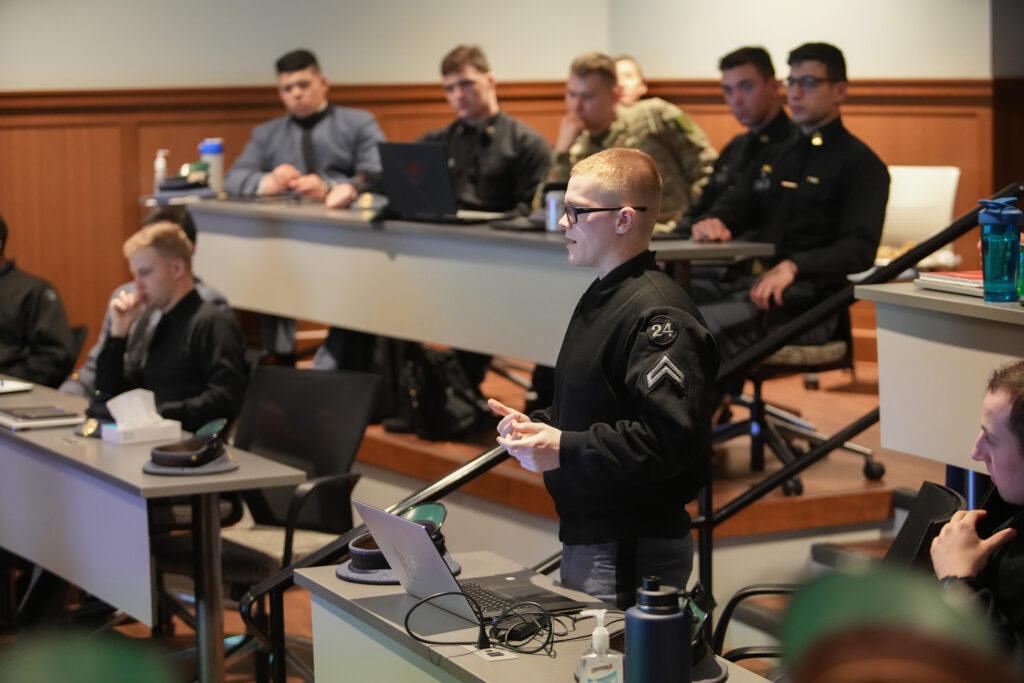 Hagen Stewart ’24 addresses the assembly during the NATO Innovation Hub “investment game simulation” in Scott Shipp Hall.