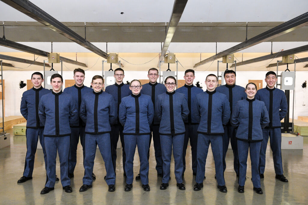 The VMI pistol team poses in the shooting range.