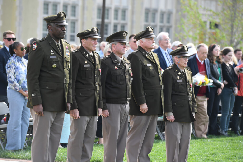 This year, four longstanding employees were honored at the parade and joined Maj. Gen. Cedric T. Wins ’85, superintendent, in taking review.