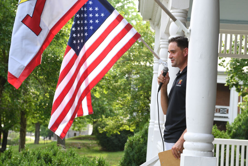 Col. John P. Casper ’04 addresses participants of the Summer Transition Program at the chaplain’s picnic July 7.