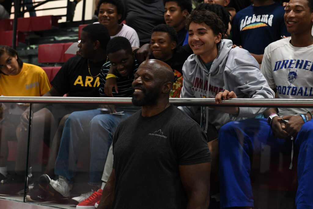Ken Harvey bonds with some of the COW program students following his motivational talk.