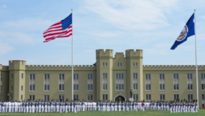 The Corps of Cadets gathers in front of barracks for a parade.