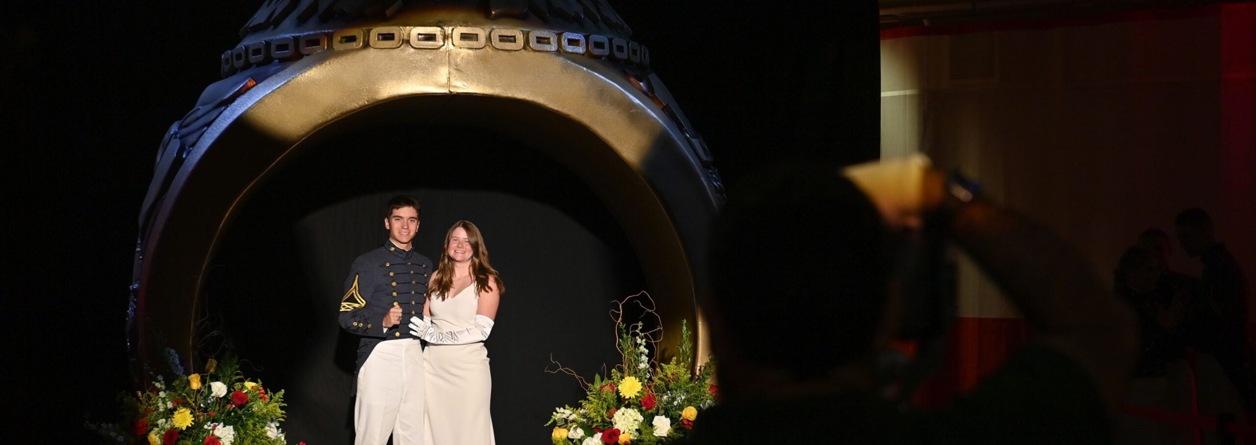 A cadet and his date pose for the ring figure dance.