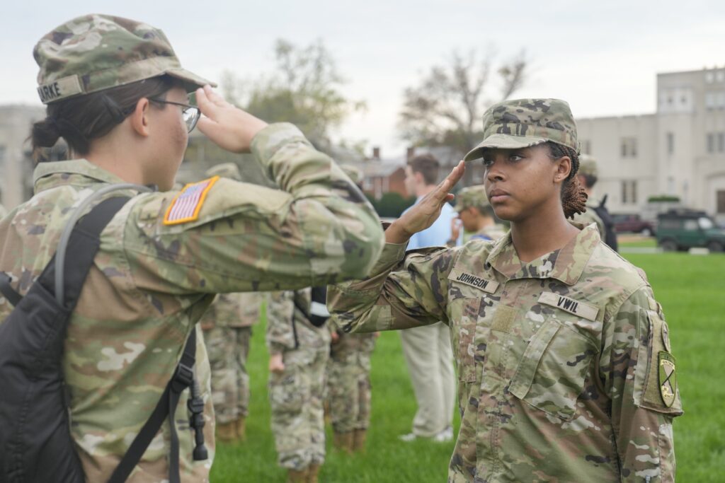 Air Force ROTC cadets in Det 880 salute each other.