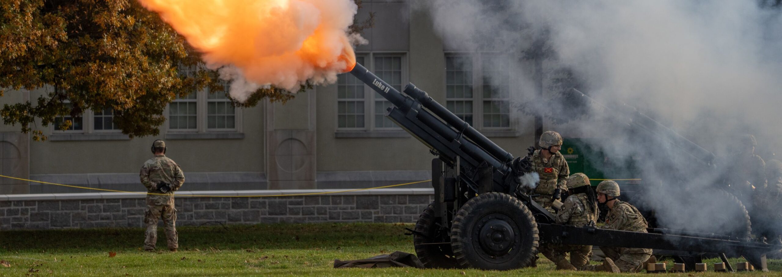A canon goes off on parade grand for Founders Day.