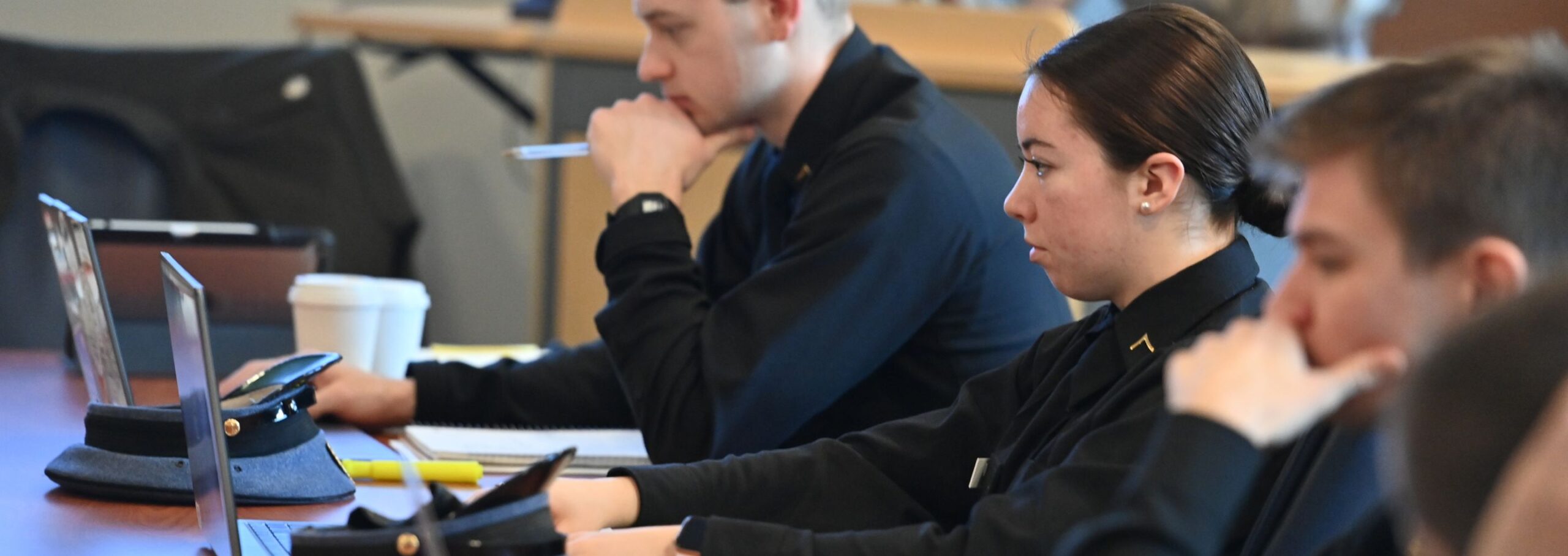 Cadets sit in a history classroom.