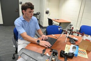 Rye Jackson ’28 surrounds himself with drones while he researches methods to detect them.