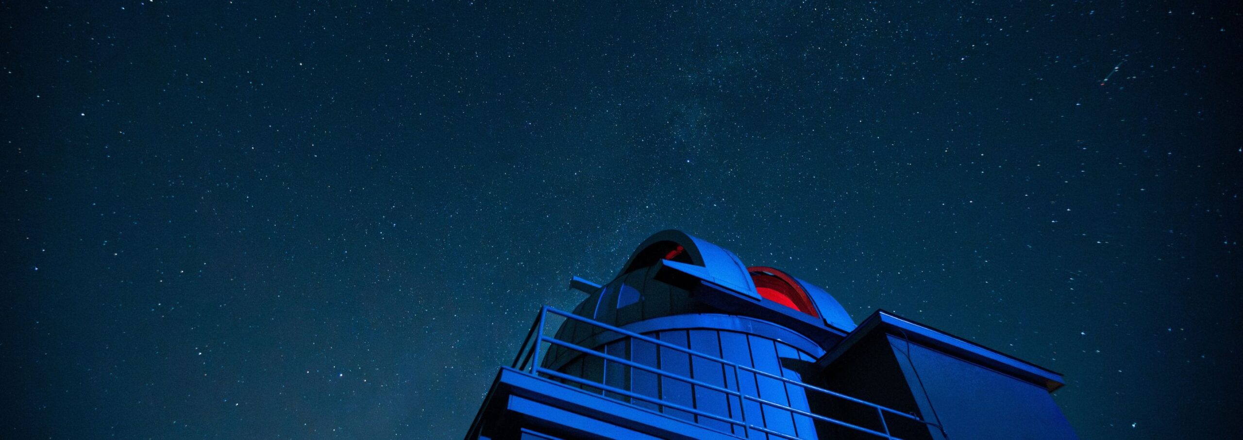 An exterior shot of the VMI observatory in the night sky.