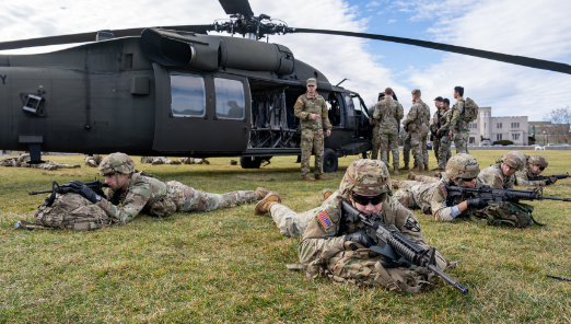 Army ROTC cadets train near a Blackhawk helicopter on post - VMI's campus.