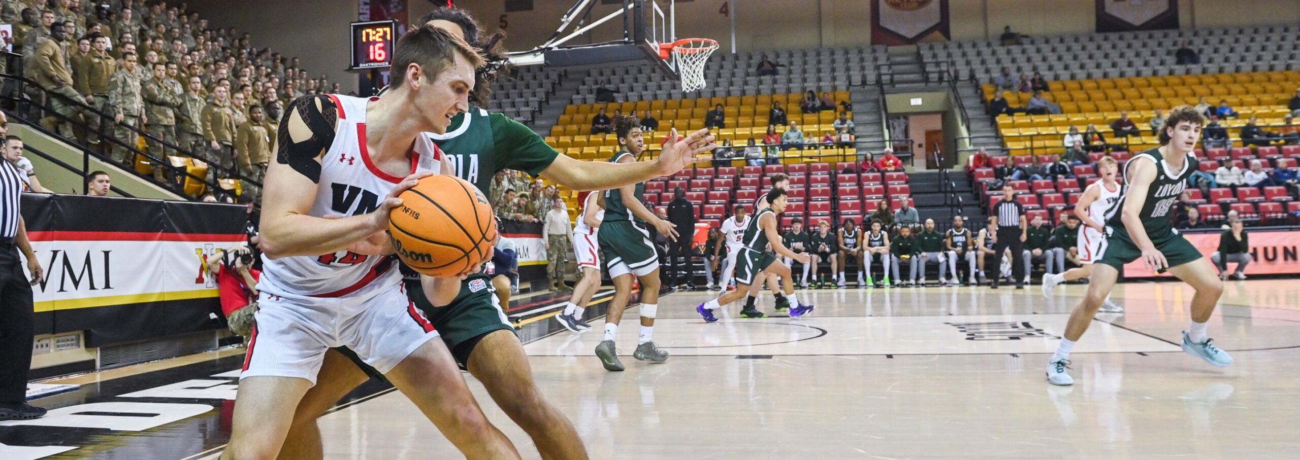 VMI basketball player on the court.