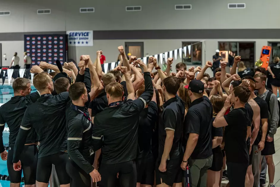 Swim & Dive cadet-athletes join for a team huddle.